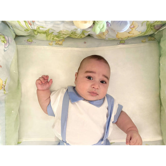 Baby sleeping on Silk Sleeve used for hair & skin protection