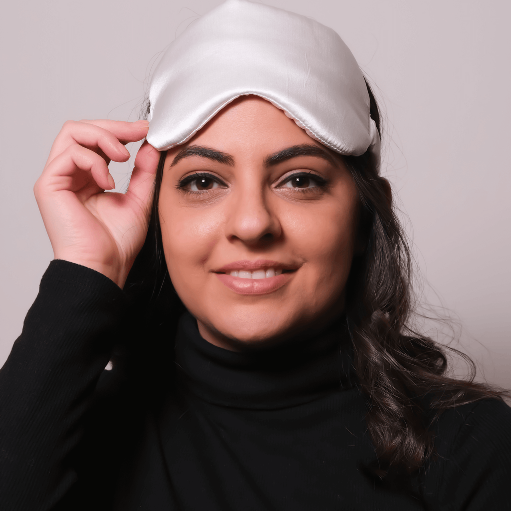 woman wearing silk eye sleeping mask 