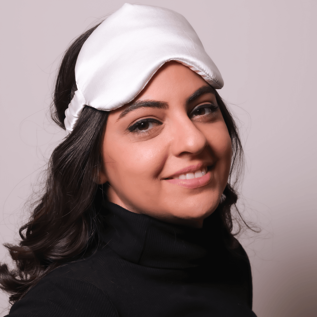 woman wearing silk eye sleeping mask 