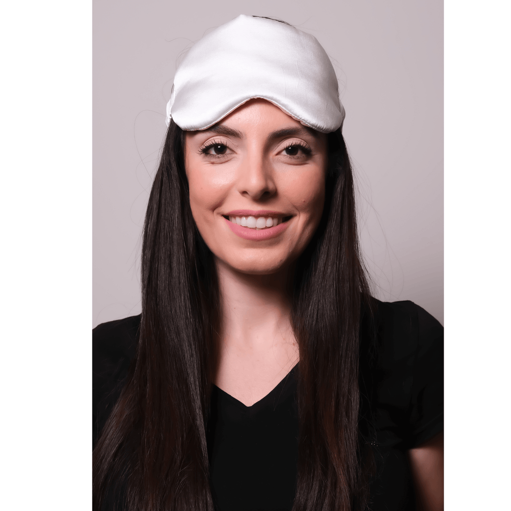 woman wearing silk eye sleeping mask 